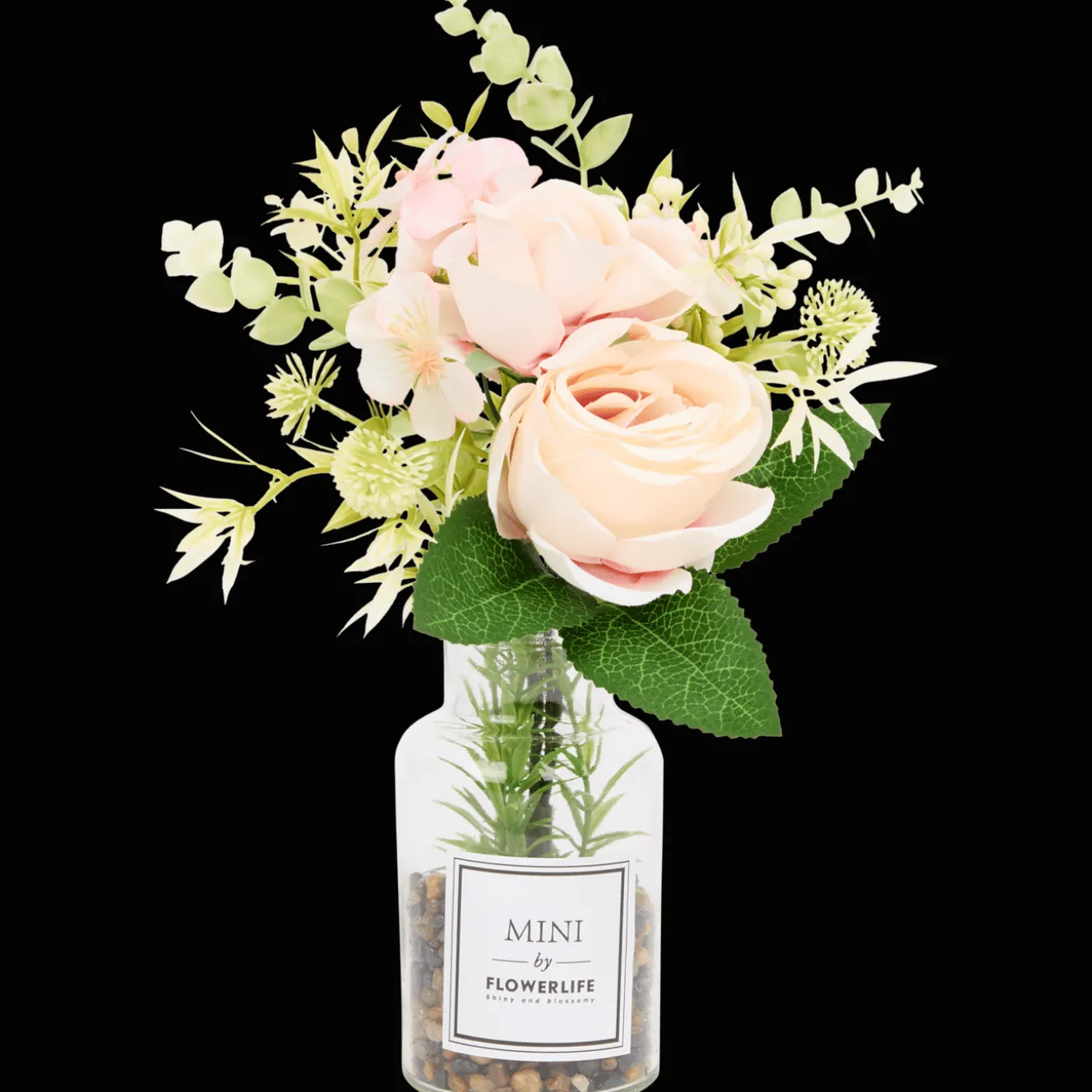 Kunstbloemen in glazen fles